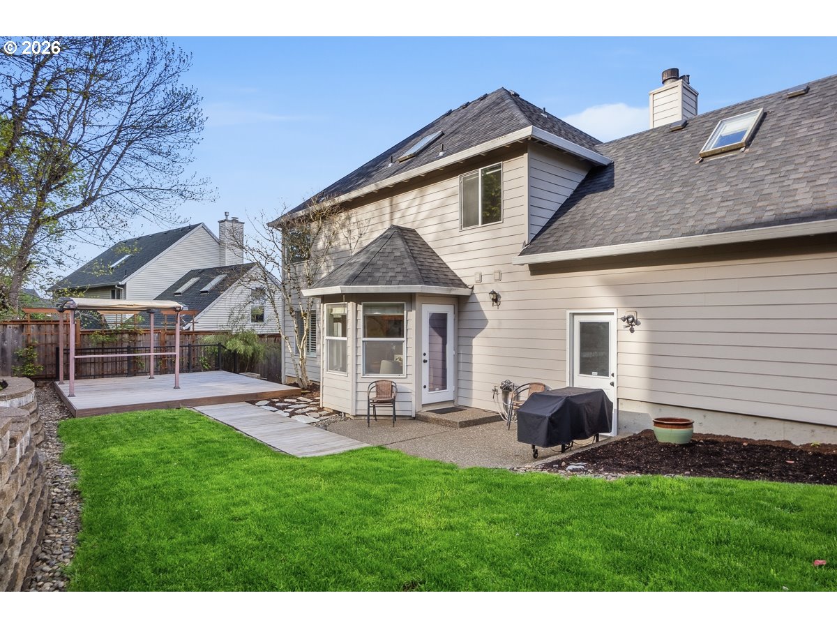8361 Southwest 168th Avenue Beaverton, OR 97007 - Photo 28 of 31 a front view of house with a garden and patio