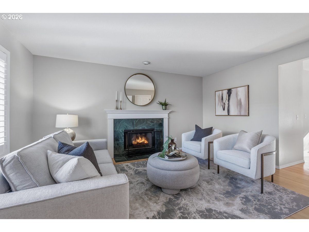8361 Southwest 168th Avenue Beaverton, OR 97007 - Photo 5 of 31 a living room with furniture and a fireplace