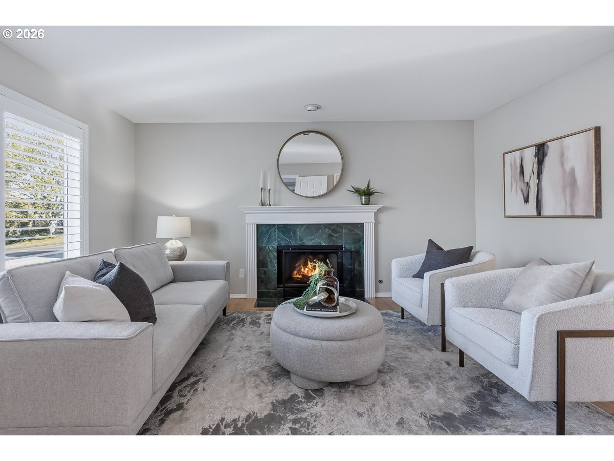 8361 Southwest 168th Avenue Beaverton, OR 97007 - Photo 6 of 31 a living room with furniture and a fireplace