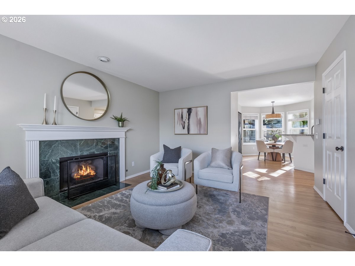 8361 Southwest 168th Avenue Beaverton, OR 97007 - Photo 7 of 31 a living room with furniture and a fireplace