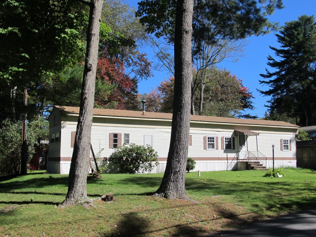 52 Gauthier Road Barre, MA 01005 - Photo 1 of 8 a front view of a house with garden
