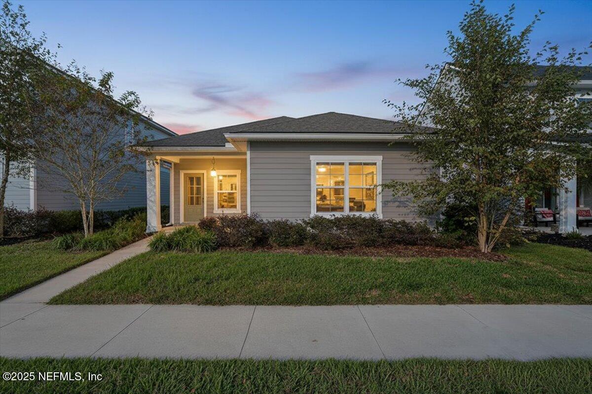 312 Clarys Run St. Augustine, FL 32092 - Photo 1 of 99 a front view of a house with a yard and garage