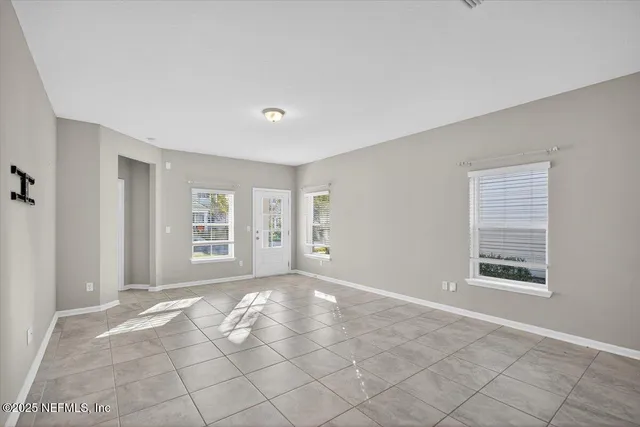 a kitchen with stainless steel appliances granite countertop a sink and a refrigerator