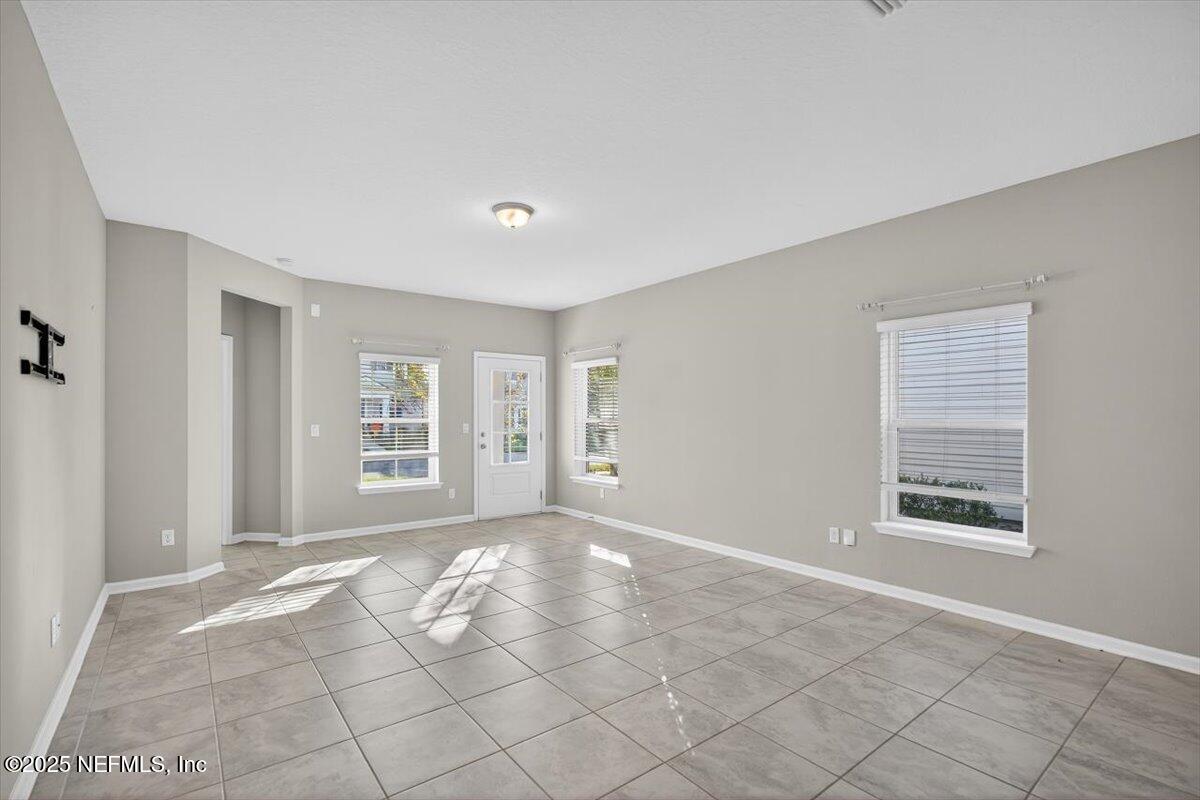 312 Clarys Run St. Augustine, FL 32092 - Photo 10 of 99 a view of an empty room with a window