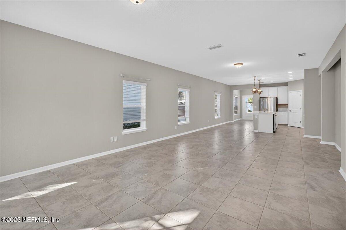 312 Clarys Run St. Augustine, FL 32092 - Photo 11 of 99 a view of empty room with wooden floor