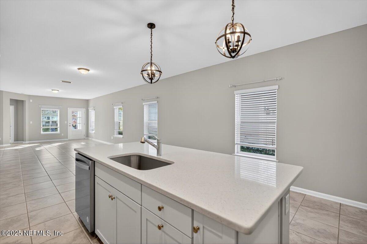 312 Clarys Run St. Augustine, FL 32092 - Photo 15 of 99 a kitchen with stainless steel appliances granite countertop a sink a stove and a granite counter tops
