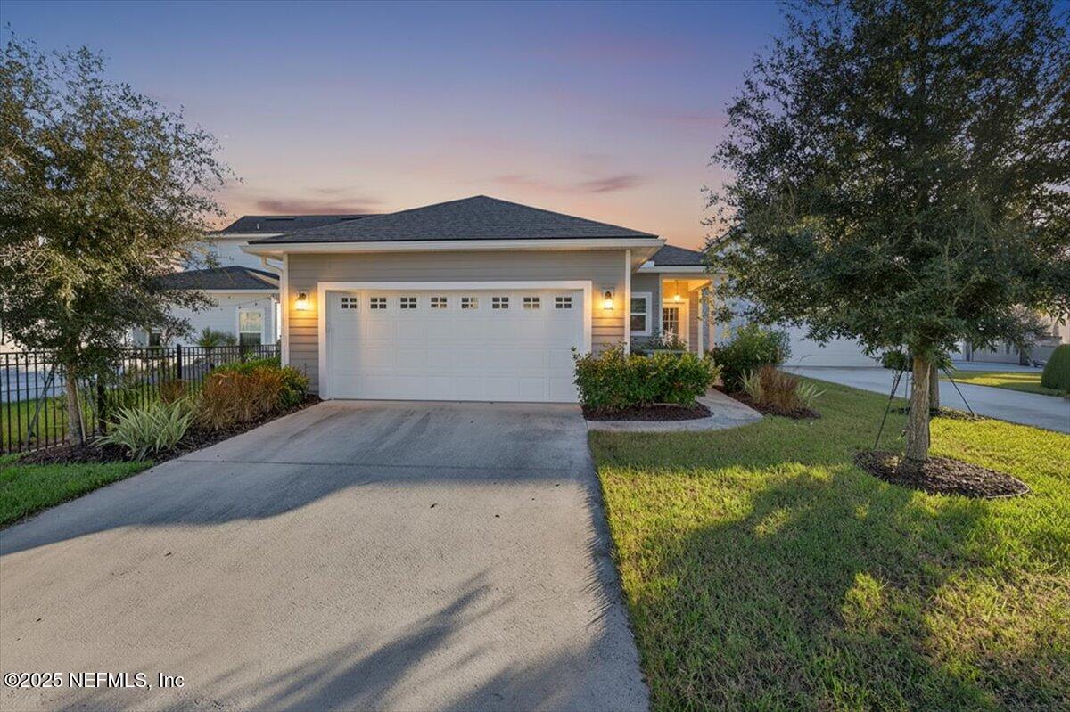 312 Clarys Run St. Augustine, FL 32092 - Photo 2 of 99 a front view of house with yard and green space