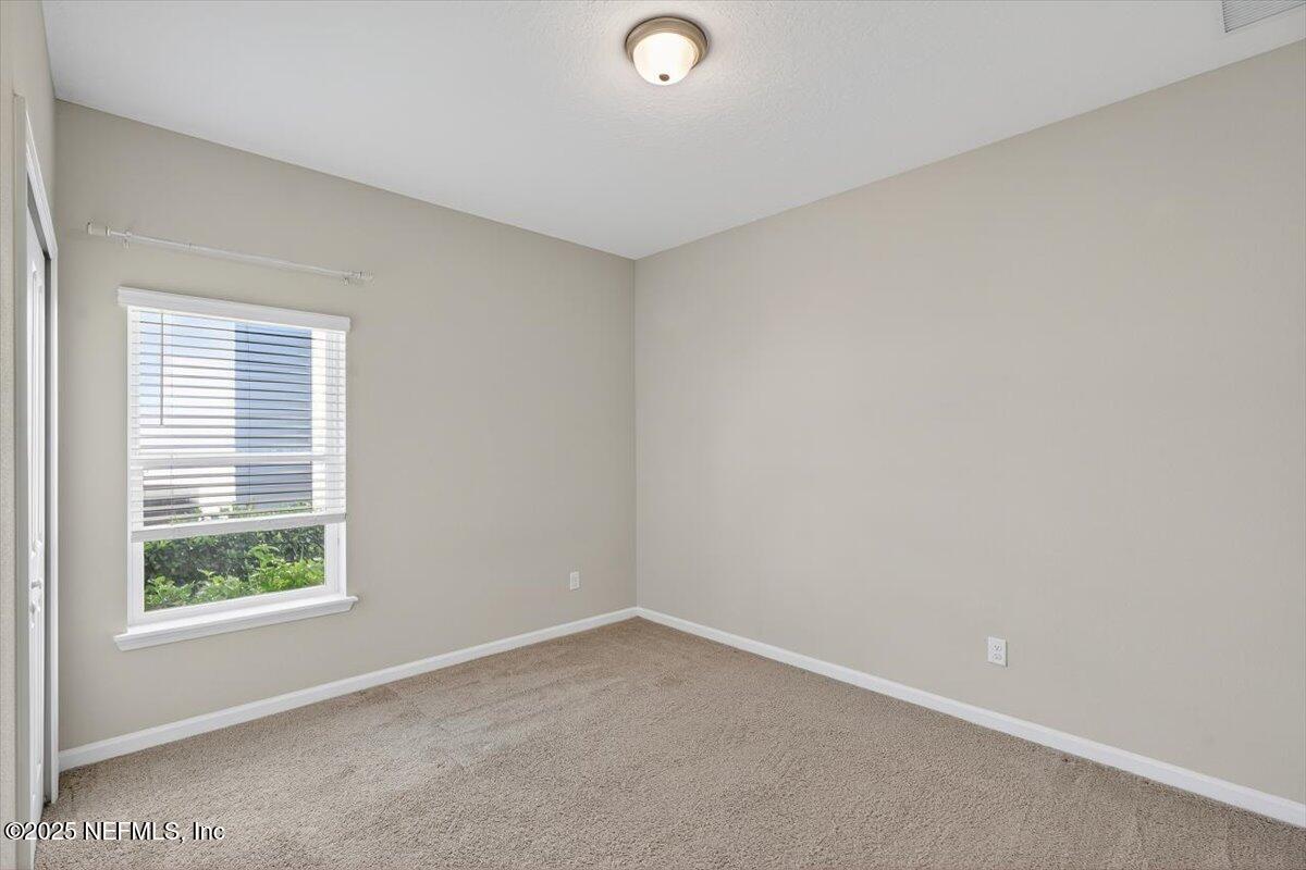 312 Clarys Run St. Augustine, FL 32092 - Photo 20 of 99 an empty room with a window