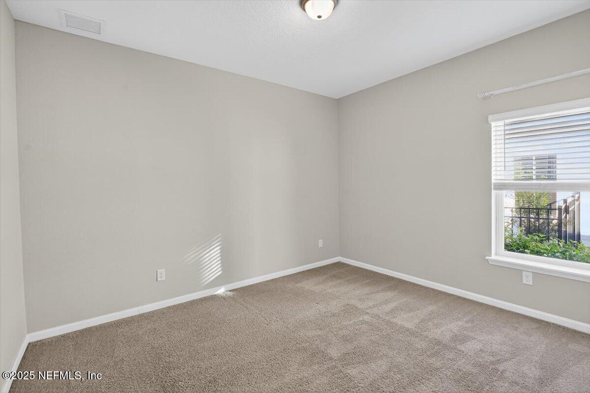312 Clarys Run St. Augustine, FL 32092 - Photo 23 of 99 an empty room with a window