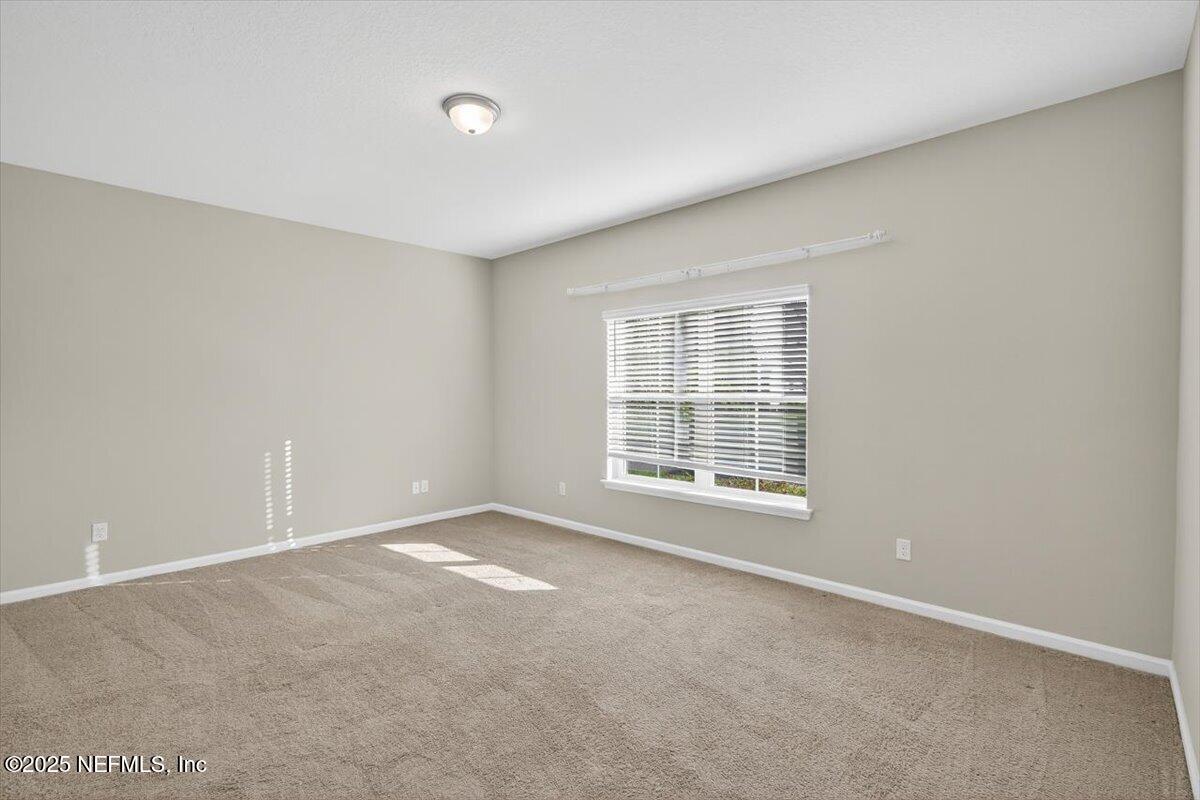 312 Clarys Run St. Augustine, FL 32092 - Photo 25 of 99 a view of an empty room with a window