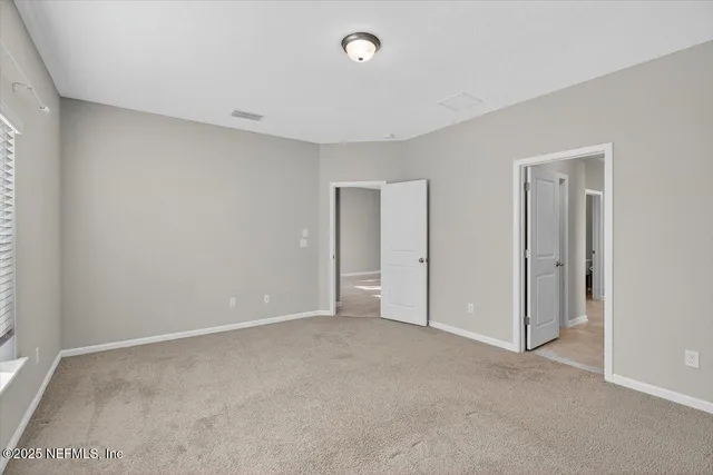 an aerial view of a house with yard