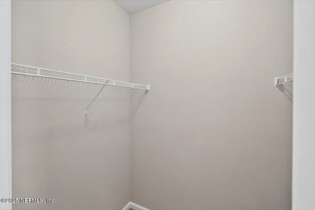 an aerial view of residential building with parking