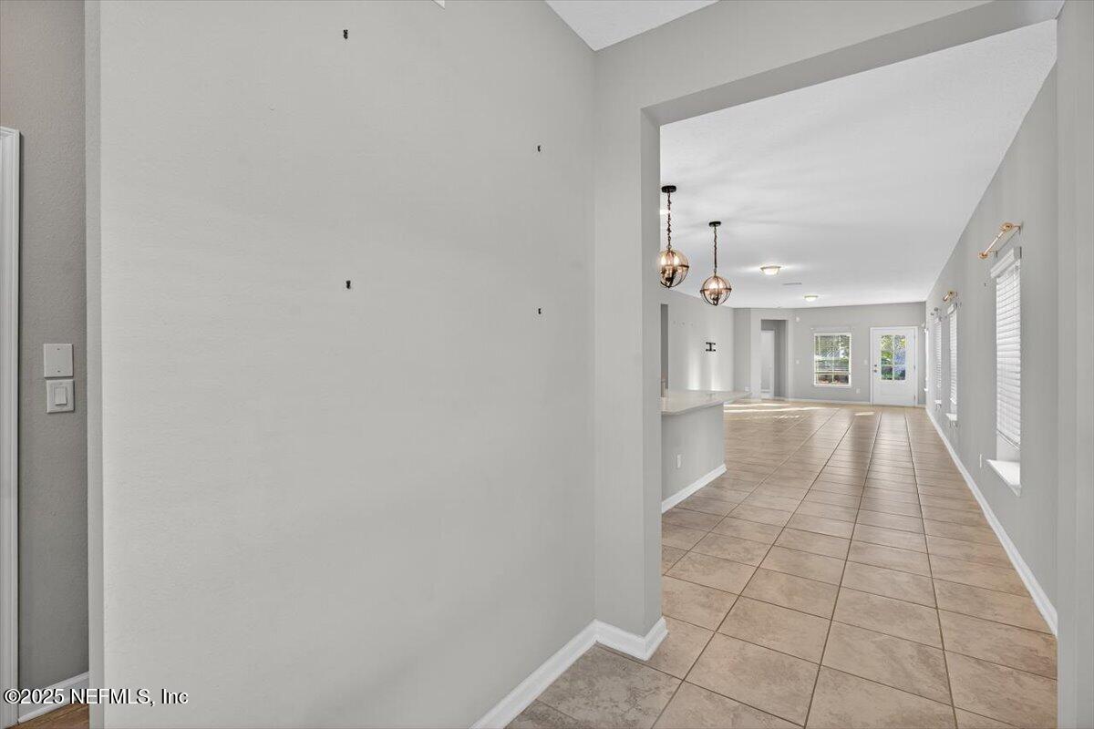 312 Clarys Run St. Augustine, FL 32092 - Photo 35 of 99 a view of a hallway with wooden floor