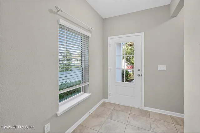 a view of a room with lots of gym equipment