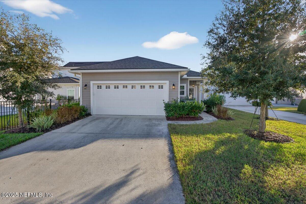 312 Clarys Run St. Augustine, FL 32092 - Photo 42 of 99 a view of a house with a yard and large tree