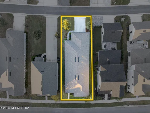an aerial view of house with yard swimming pool and outdoor seating
