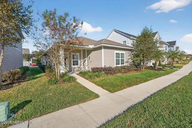 a view of a livingroom with furniture and an entryway