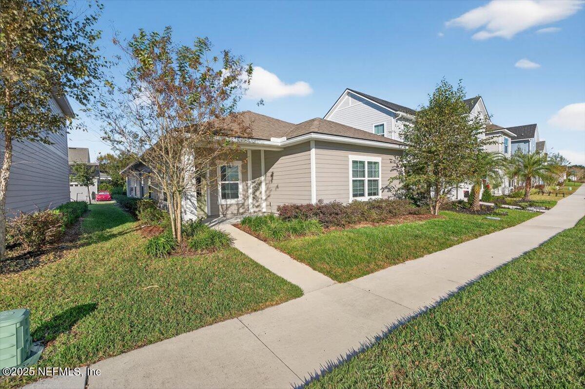 312 Clarys Run St. Augustine, FL 32092 - Photo 4 of 99 a front view of house with yard and green space