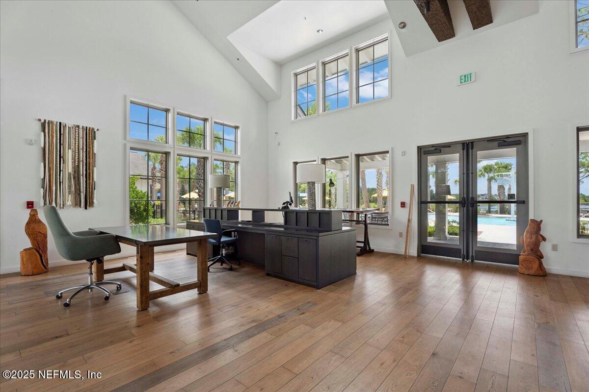 312 Clarys Run St. Augustine, FL 32092 - Photo 70 of 99 a living room with furniture and a wooden floor