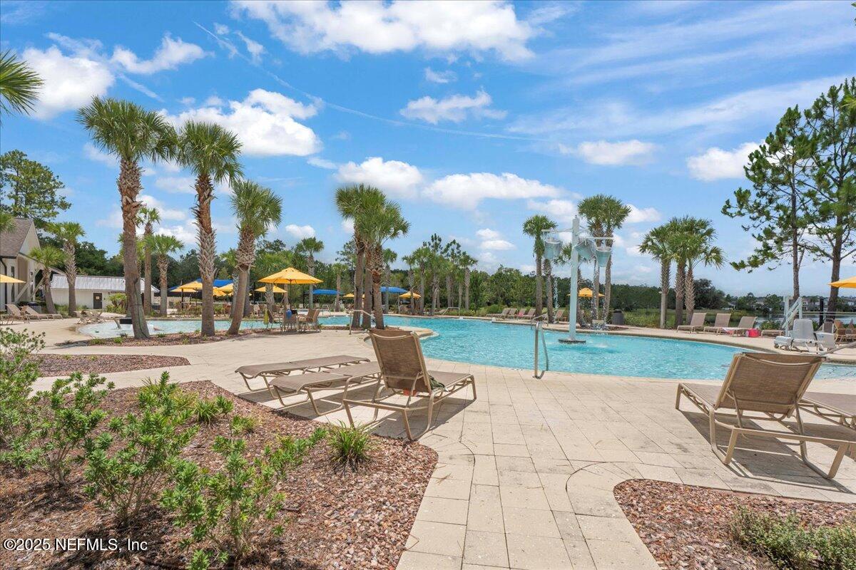 312 Clarys Run St. Augustine, FL 32092 - Photo 72 of 99 a view of a park with swings and slides