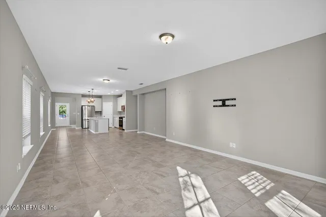 a kitchen with stainless steel appliances granite countertop a sink a stove and a granite counter tops