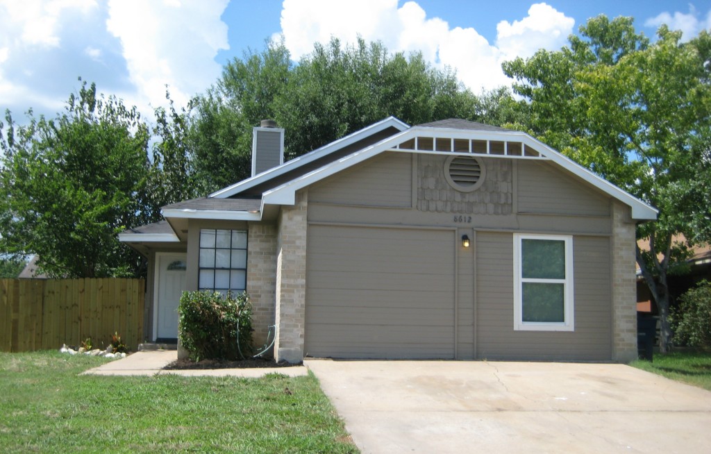 8612 Croydon Loop Austin, TX 78748 - Photo 1 of 1 a front view of a house with a yard