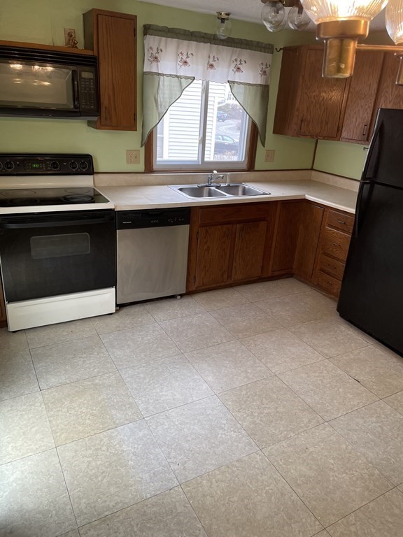 270 Sunderland Road, Unit 76 Worcester, MA 01604 - Photo 8 of 21 a kitchen with stainless steel appliances granite countertop a sink and a stove