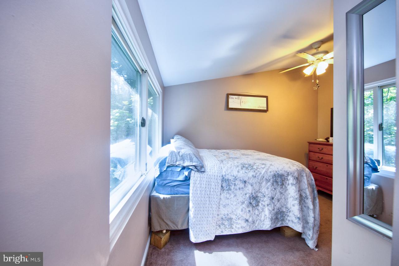 268 Hilltop Road Delta, PA 17314 - Photo 14 of 20 Master bedroom w/ large window and view of strea