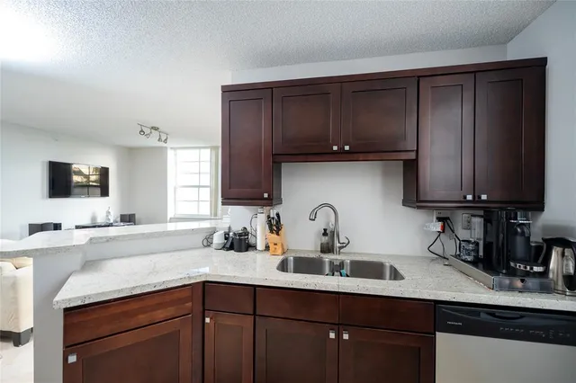a bedroom with a bed and flat screen tv