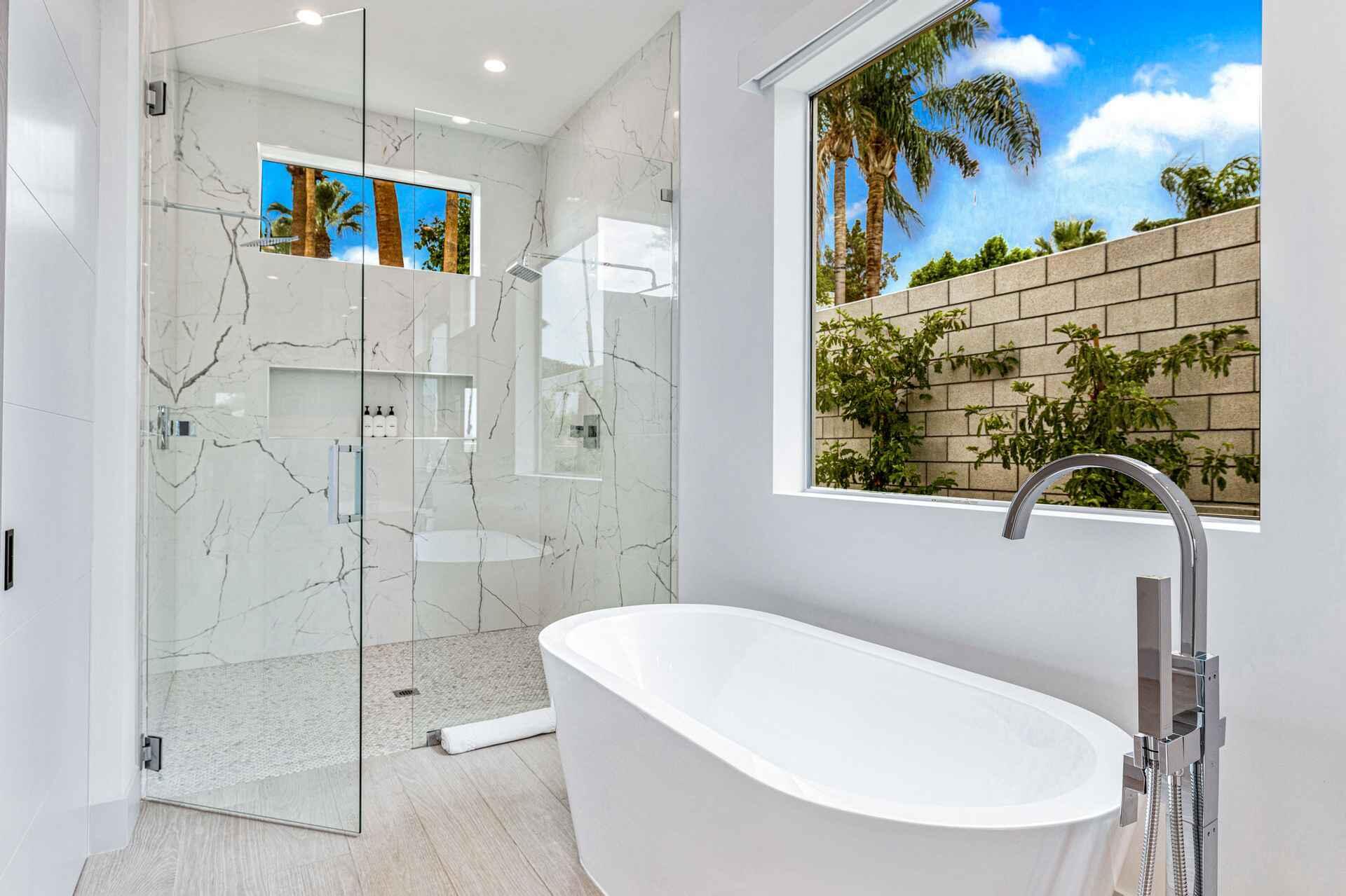 72985 Somera Road Palm Desert, CA 92260 - Photo 11 of 17 a bathroom with a bathtub and a shower