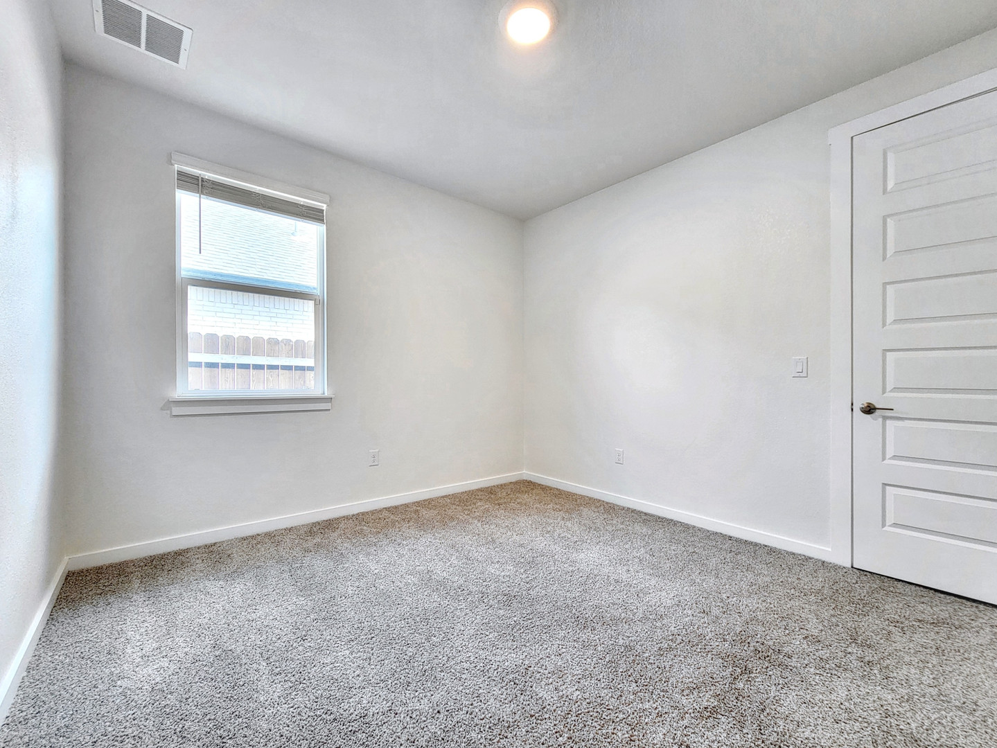 2329 Gabriels Horn Road Leander, TX 78641 - Photo 19 of 23 A well-lit, open room with plush carpeting offers comfort and versatility.