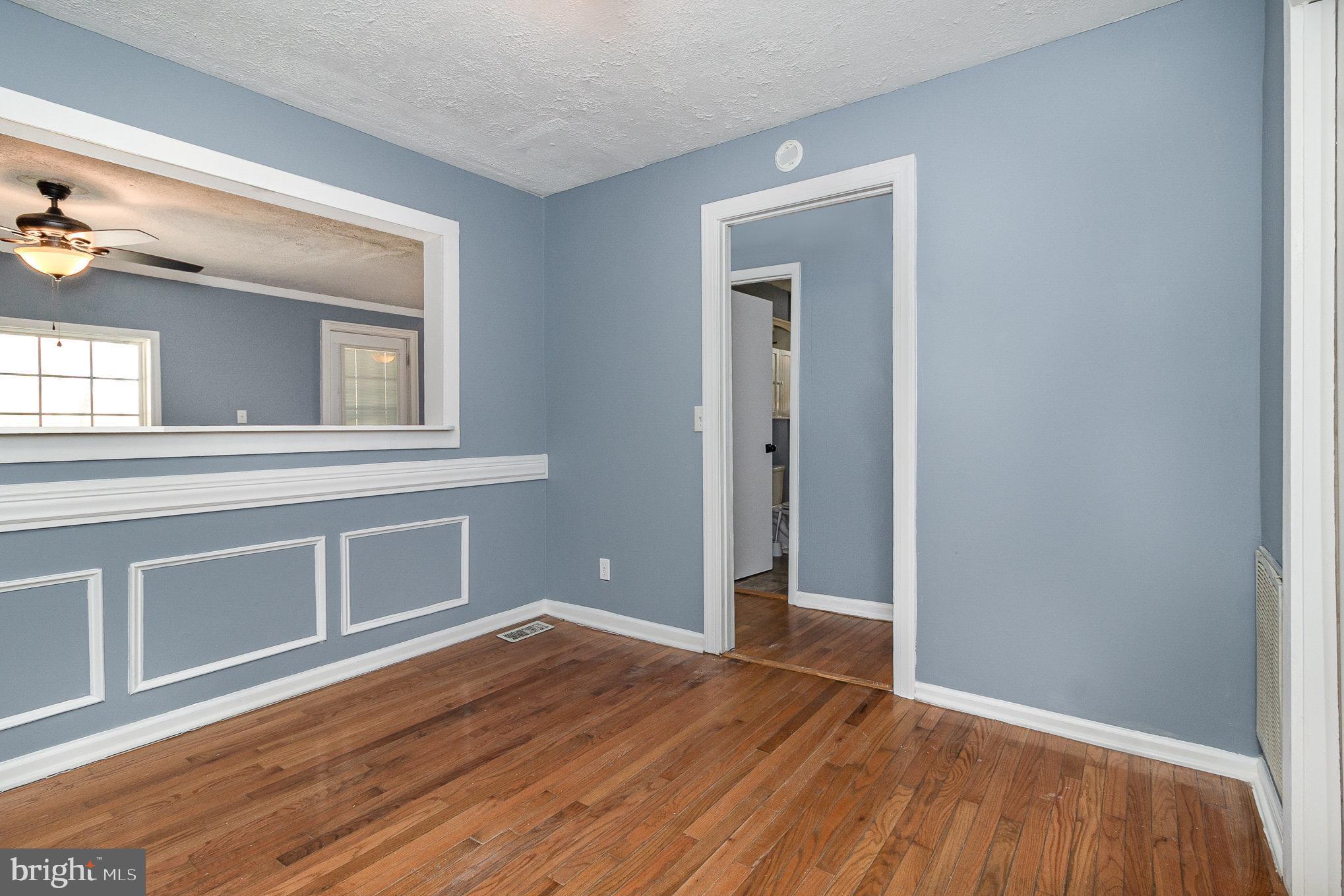 16520 Tomahawk Creek Road Orange, VA 22960 - Photo 12 of 31 a view of an empty room with wooden floor and a window