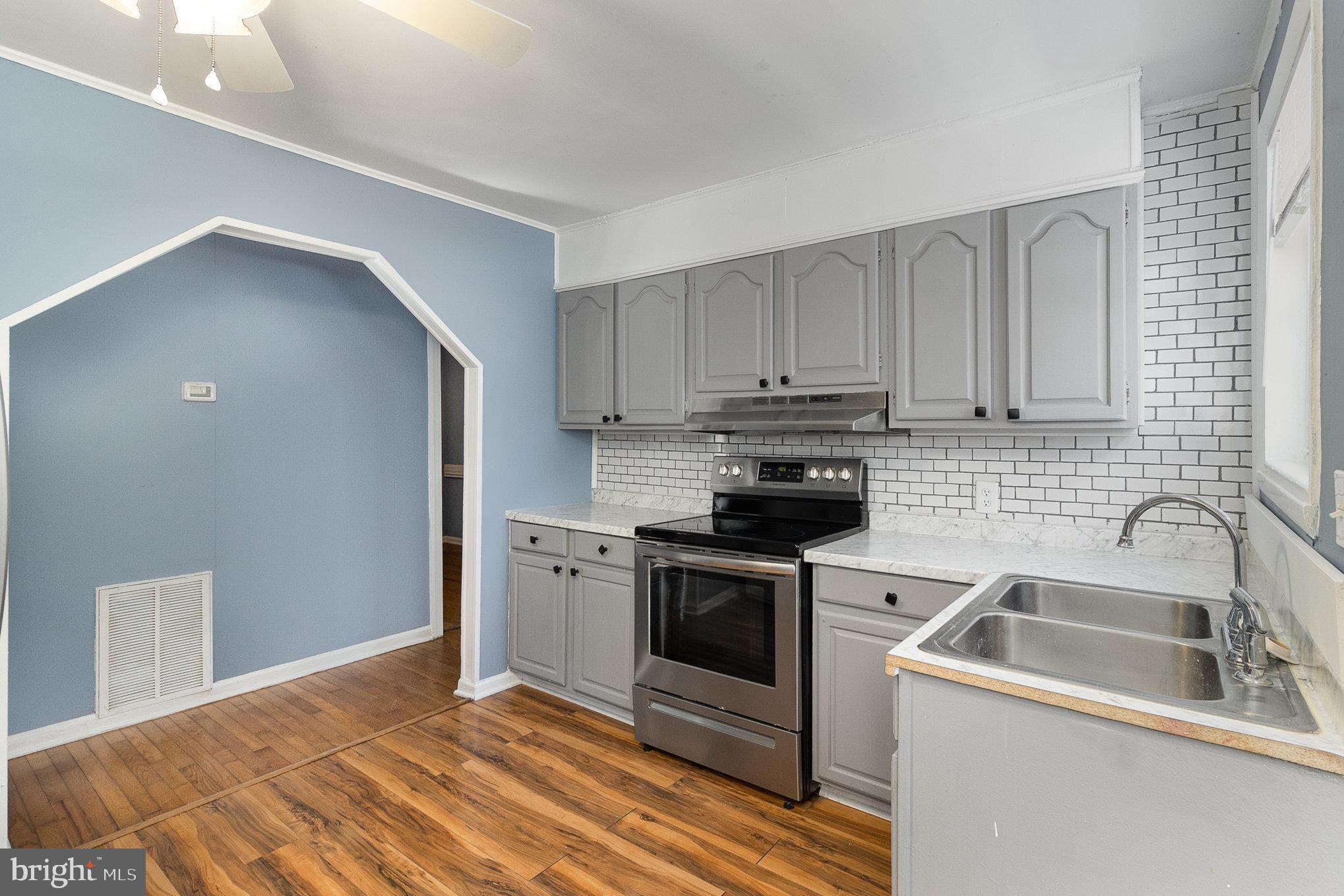 16520 Tomahawk Creek Road Orange, VA 22960 - Photo 13 of 31 a kitchen with a sink cabinets and stainless steel appliances