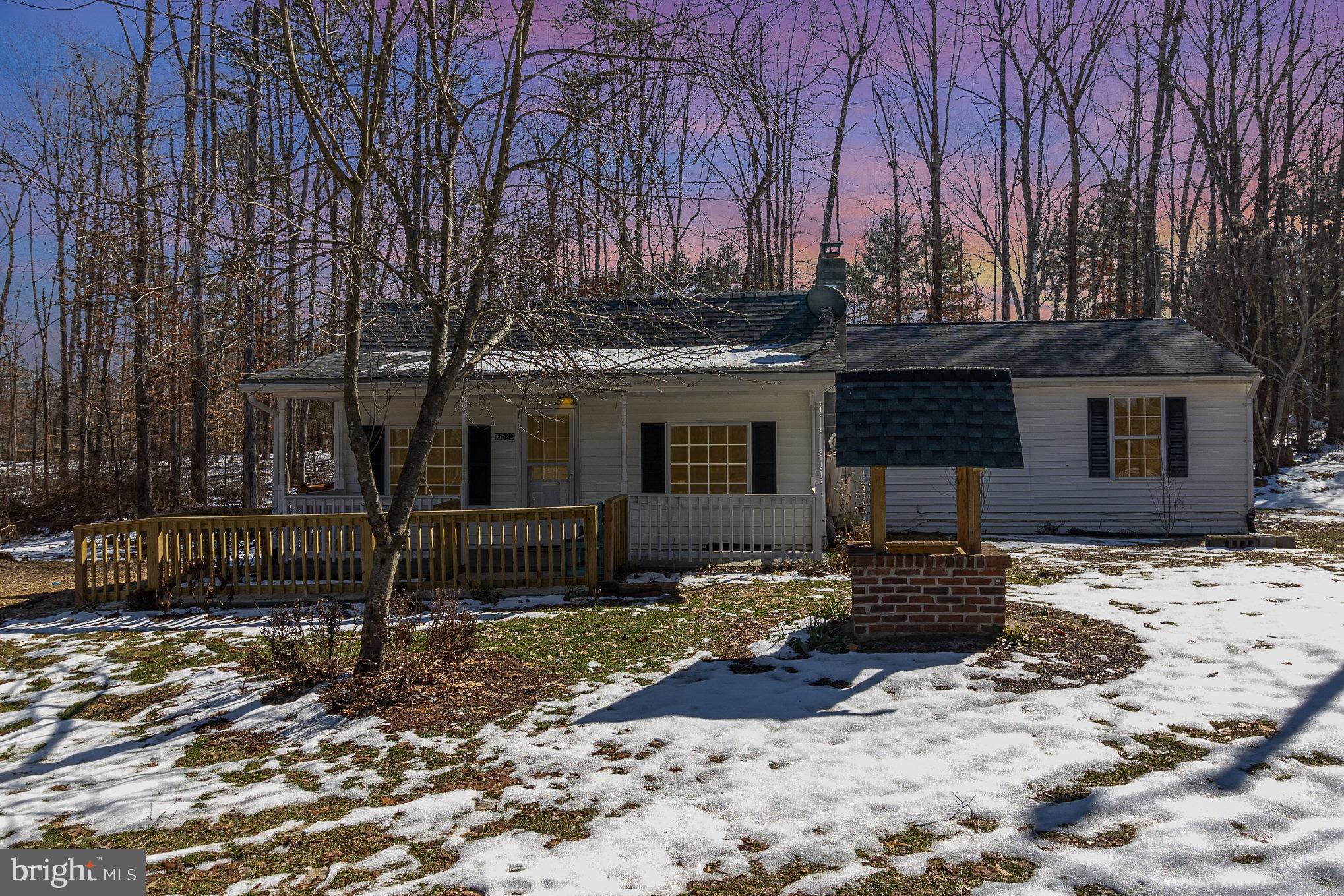 16520 Tomahawk Creek Road Orange, VA 22960 - Photo 2 of 31 a front view of a house with a yard covered with snow in front of house