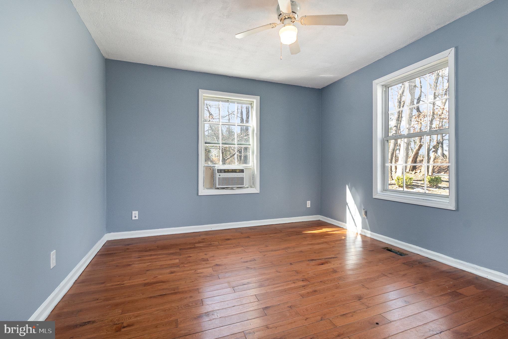 16520 Tomahawk Creek Road Orange, VA 22960 - Photo 26 of 31 a view of an empty room with wooden floor and a window