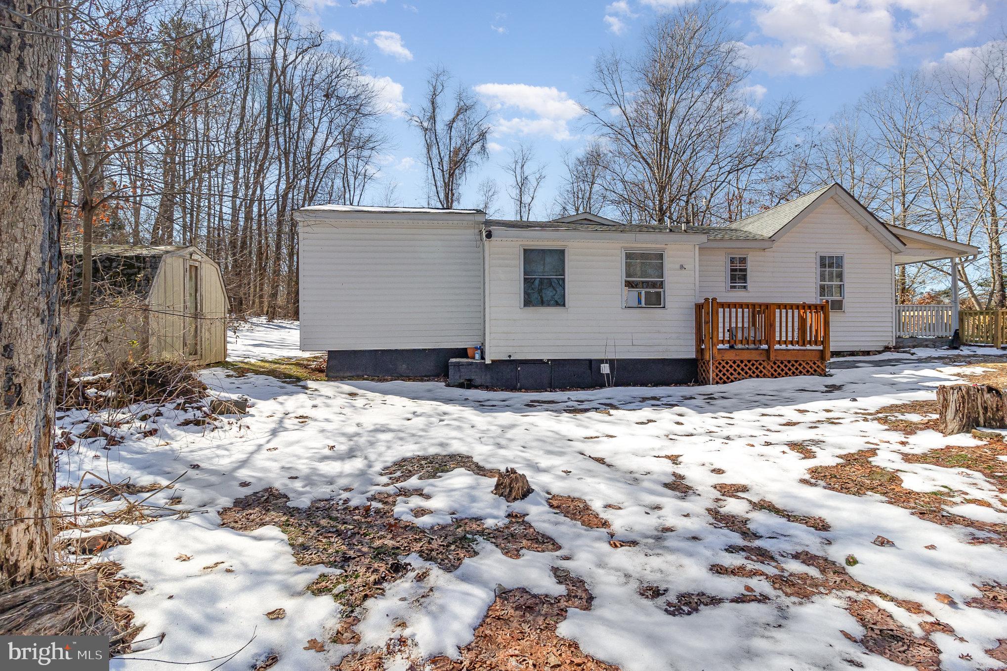 16520 Tomahawk Creek Road Orange, VA 22960 - Photo 27 of 31 a view of a house with a yard covered in snow