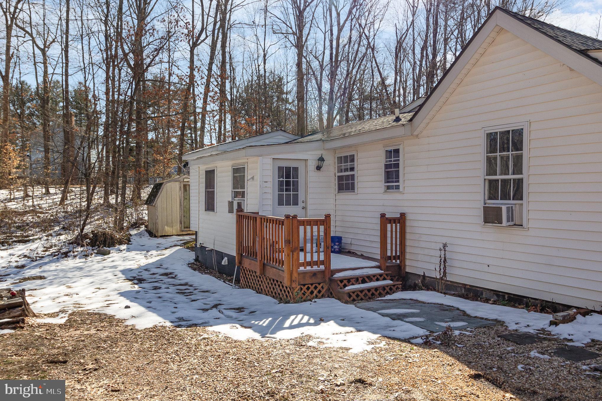 16520 Tomahawk Creek Road Orange, VA 22960 - Photo 29 of 31 a view of a house with a yard covered in snow