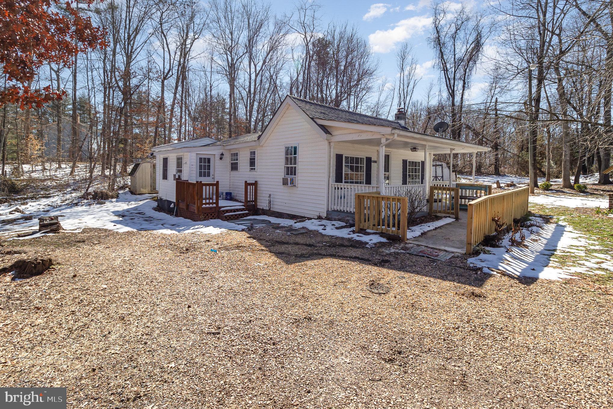 16520 Tomahawk Creek Road Orange, VA 22960 - Photo 3 of 31 a view of a house with a yard covered in snow