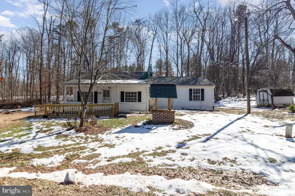 a view of a house with snow on the floor