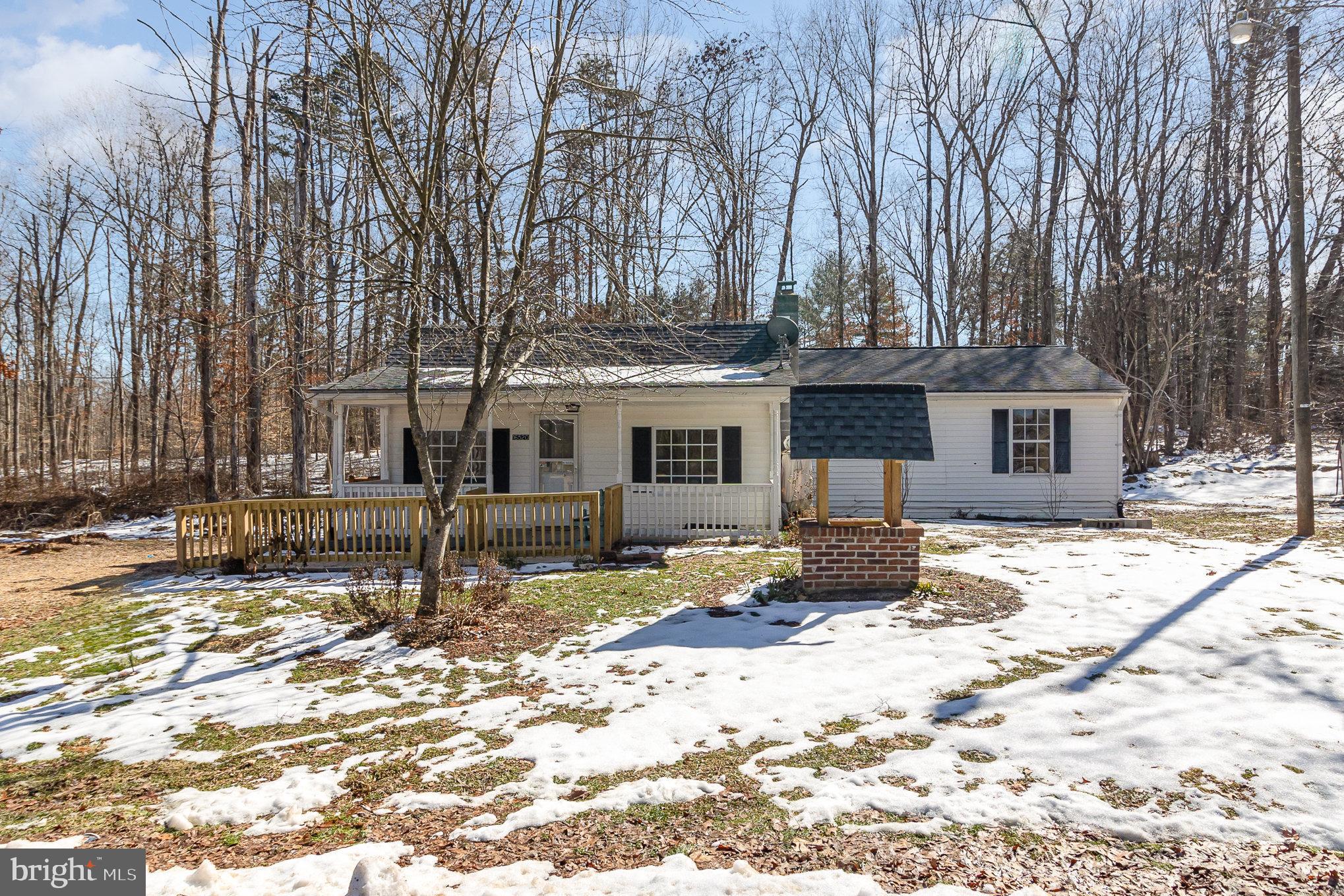 16520 Tomahawk Creek Road Orange, VA 22960 - Photo 6 of 31 a front view of a house with a yard covered in snow