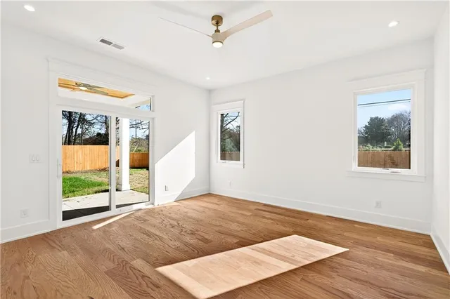 a bathroom with a tub a toilet and a shower