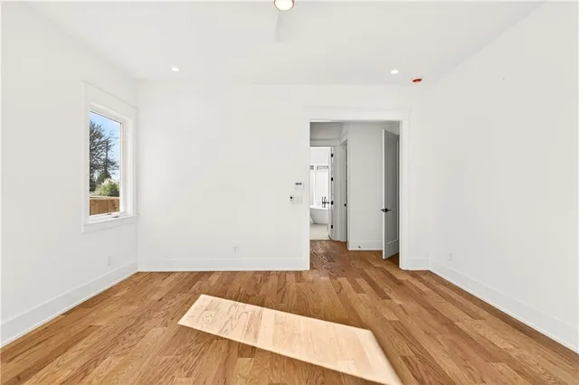 a spacious bathroom with a double vanity sink a mirror and a shower