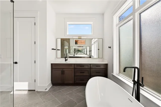 a view of hallway with wooden floor