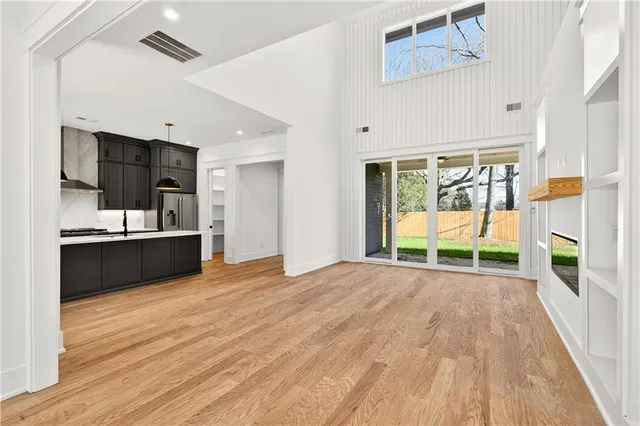 a view of a kitchen with a sink and a large window