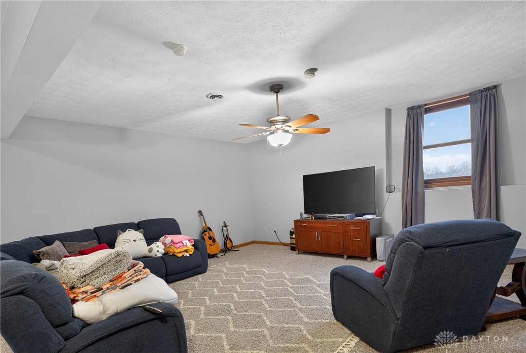 5264 Frazier-Guy Road Sidney, OH 45365 - Photo 32 of 51 This inviting space features comfortable carpeting and a bright window, perfect for relaxation.