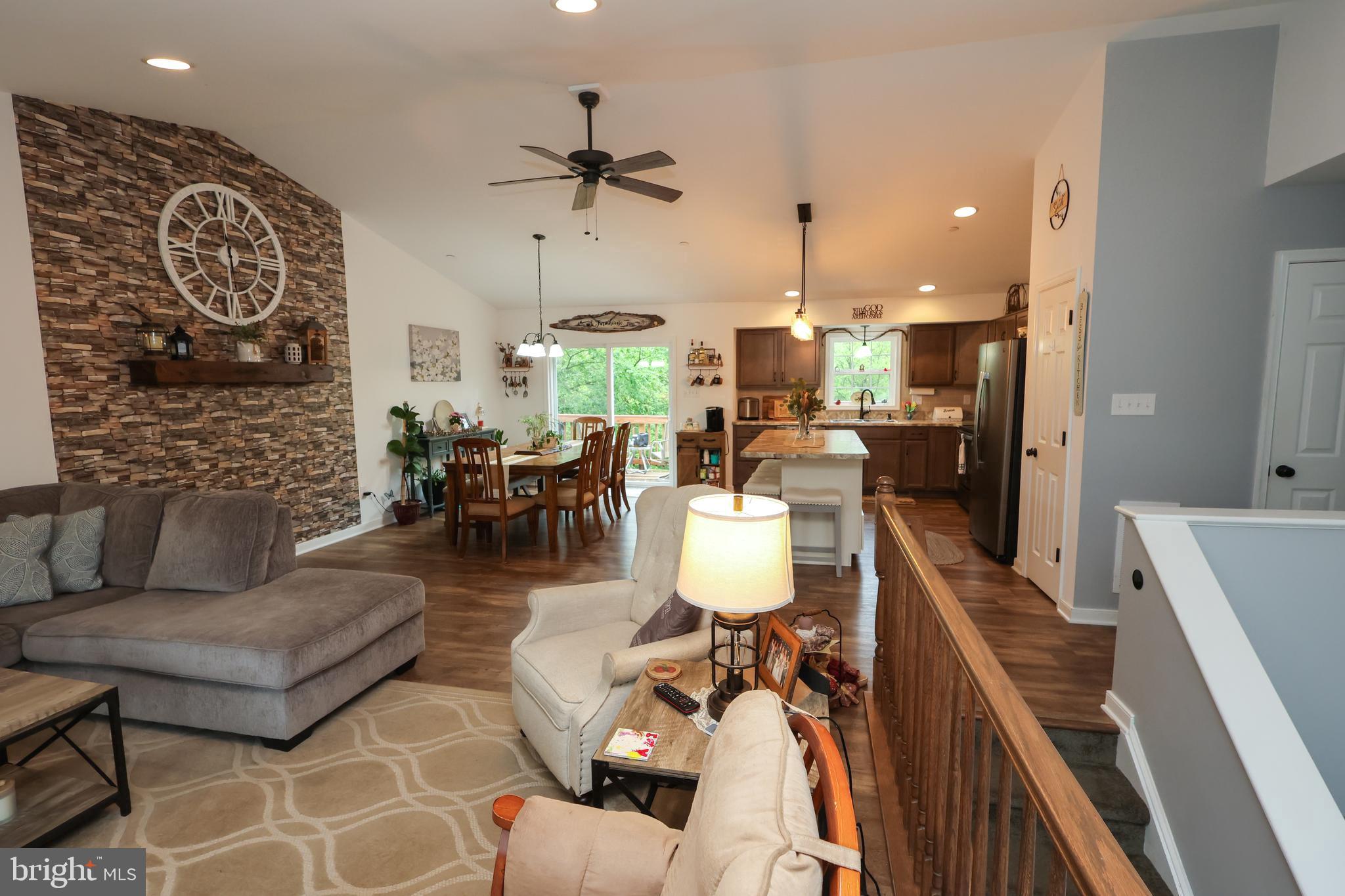16919 Shaffer Road Sharpsburg, MD 21782 - Photo 5 of 58 a living room with fireplace furniture and a wooden floor