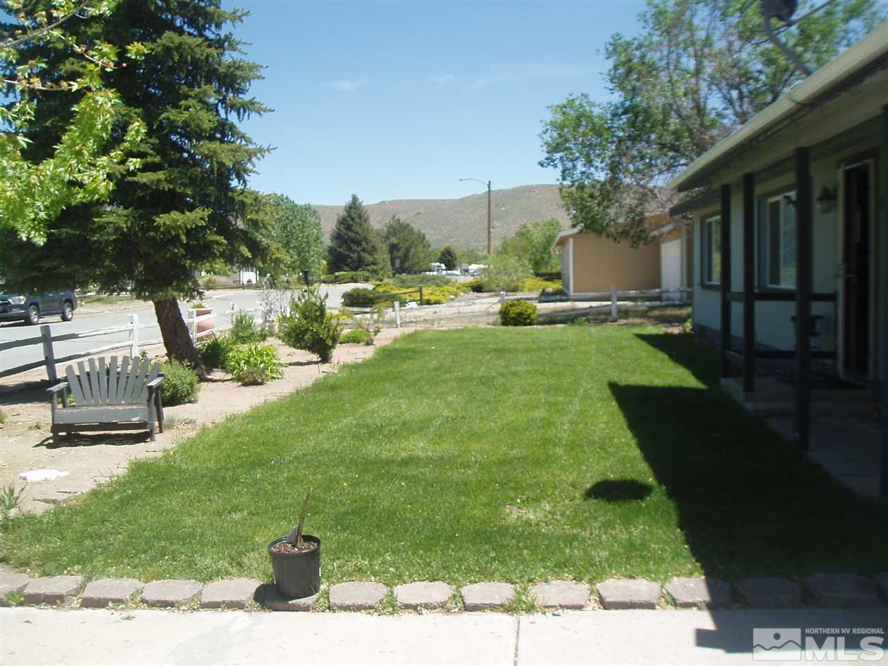 17570 Fantail Street Reno, NV 89508 - Photo 3 of 22 a view of backyard with outdoor seating and green space