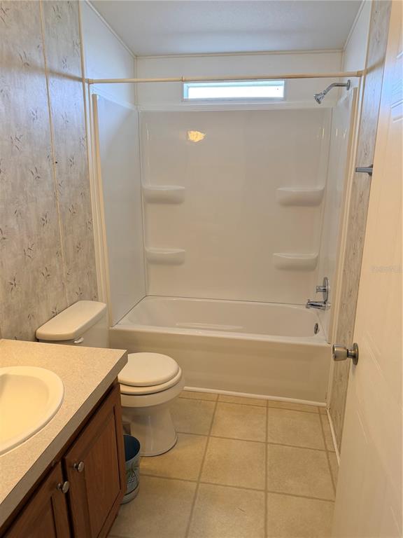 33 Ridge Road Frostproof, FL 33843 - Photo 9 of 21 a bathroom with a sink a toilet and shower