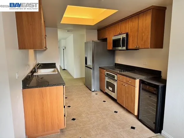 a kitchen that has a sink and a stove