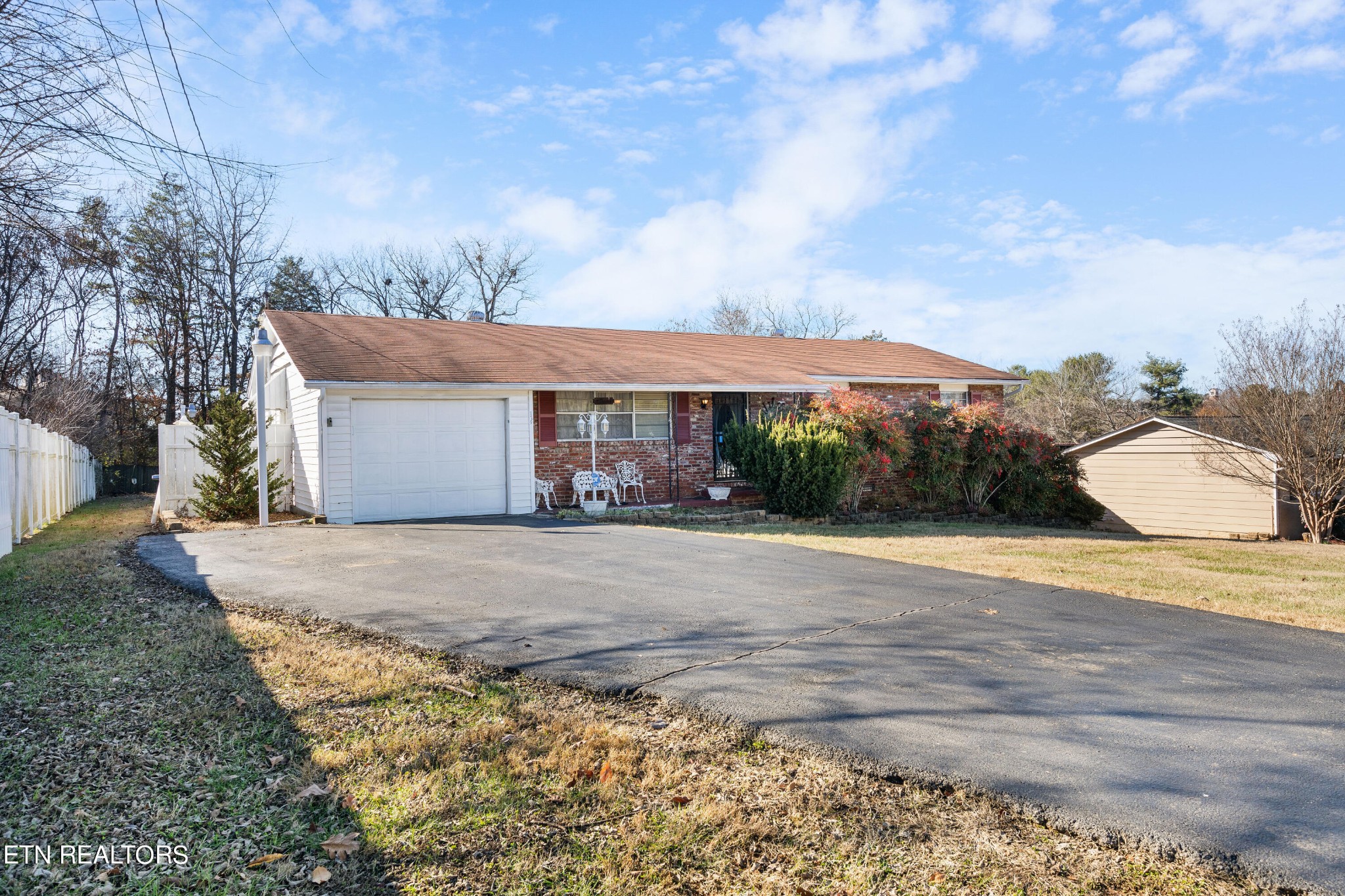 129 Peterson Road Knoxville, TN 37934 - Photo 1 of 24 a front view of house with yard and trees in the background